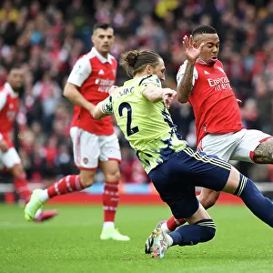 Arsenal vs Leeds United: Gabriel Jesus Tussles with Luke Ayling in Premier League Showdown (2022-23)