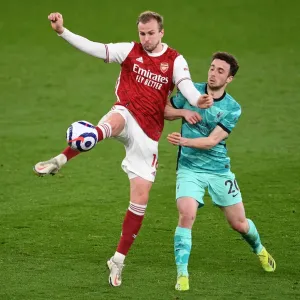 Arsenal vs. Liverpool: Holding Clears Under Pressure in Intense Premier League Clash
