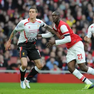 Arsenal vs. Liverpool: Intense Battle Between Yaya Sanogo and Daniel Agger in the FA Cup Arsenal vs. Liverpool: Intense Battle Between Yaya Sanogo and Daniel Agger in the FA Cup