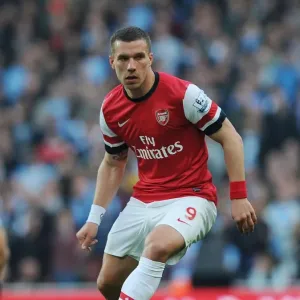 Arsenal vs Manchester City: Lukas Podolski in Action at the Emirates Stadium, Premier League 2013/14