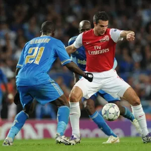 Arsenal vs. Marseille: Robin van Persie Clashes with Souleymane Diawara in the 2011-12 UEFA Champions League Arsenal vs. Marseille: Robin van Persie Clashes with Souleymane Diawara in the 2011-12 UEFA Champions League