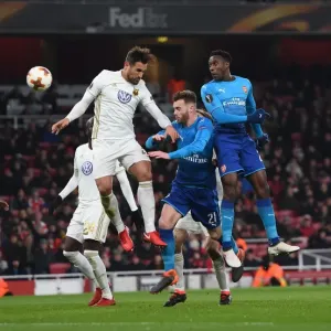 Arsenal vs Östersunds FK: Intense Aerial Battle Between Danny Welbeck and Sotirios Papagiannopoulos, Calum Chambers