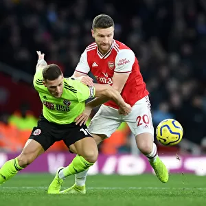 Arsenal vs Sheffield United: Mustafi Clashes with Sharp in Premier League Showdown