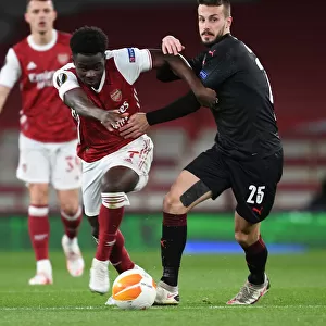 Arsenal vs Slavia Praha: Bukayo Saka in Action at Empty Emirates Stadium - UEFA Europa League Quarterfinal