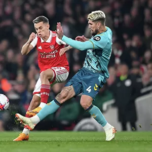 Arsenal vs. Southampton: Trossard Fights for Possession in Intense Premier League Clash