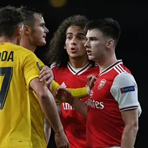 Arsenal vs Standard Liege: Clash Between Kieran Tierney and Mergim Vojvoda in Europa League Match