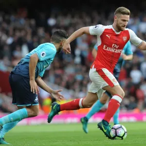 Arsenal vs Swansea City: Mustafi vs Taylor - Intense Clash in Premier League (2016-17)