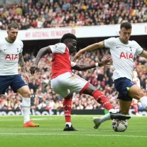 Arsenal vs. Tottenham: Bukayo Saka Faces Off Against Ivan Perisic in the 2022-23 Premier League Clash at Emirates Stadium