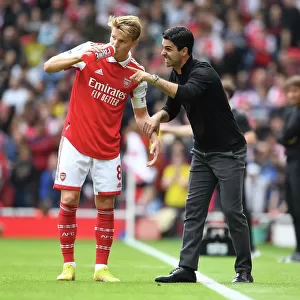 Arsenal vs. Tottenham: Mikel Arteta and Martin Odegaard in Deep Conversation during the 2022-23 Premier League Clash at Emirates Stadium