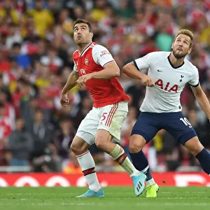 Arsenal vs. Tottenham: Sokratis Challenges Kane in Intense Premier League Clash (2019-20)