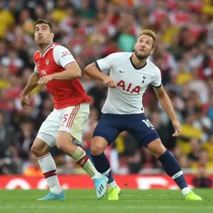 Arsenal vs. Tottenham: Sokratis Challenges Kane in Intense Premier League Clash (2019-20) Arsenal vs. Tottenham: Sokratis Challenges Kane in Intense Premier League Clash (2019-20)