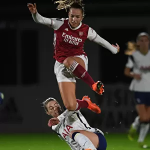Arsenal vs. Tottenham Women's FA Cup Clash: Lia Walti Leaps Over Alanna Kennedy Amid Empty Stands
