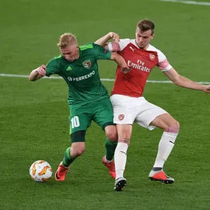 Arsenal vs Vorskla Poltava: Rob Holding Tackles Vladyslav Kulach in Europa League Clash