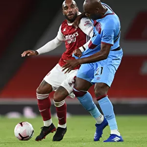 Arsenal vs. West Ham: Lacazette vs. Ogbonna in Intense Battle at Emirates Stadium