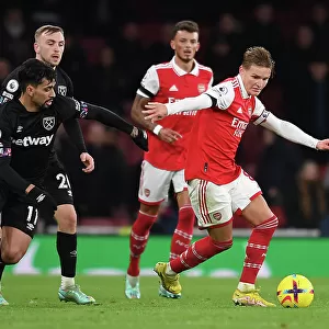 Arsenal vs. West Ham: Martin Odegaard Clashes with Lucas Paqueta in Premier League Showdown (December 2022)