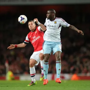 Arsenal vs. West Ham: Podolski vs. Demel - Premier League Clash at Emirates Stadium Arsenal vs. West Ham: Podolski vs. Demel - Premier League Clash at Emirates Stadium