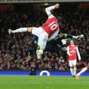 Arsenal vs. Wigan: Van Persie vs. Figueroa in Intense Battle
