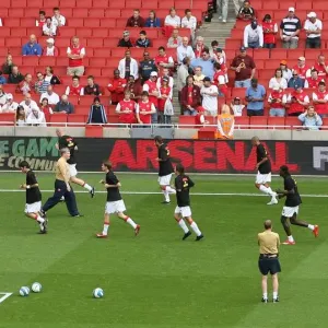 Arsenal warm up in front of the Arsenal For Everyone boards Arsenal warm up in front of the Arsenal For Everyone boards