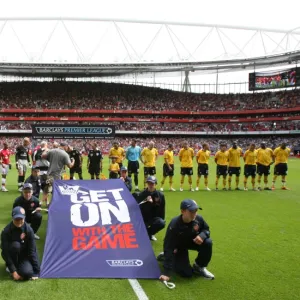 Arsenal and WBA teams line up before the match