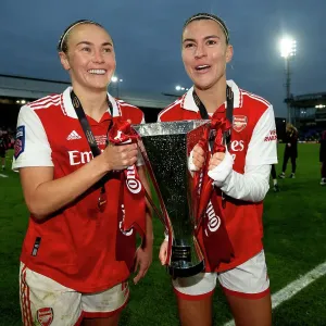 Arsenal Women Celebrate Conti Cup Victory: Steph Catley and Caitlin Foord Hold the Trophy (2023)