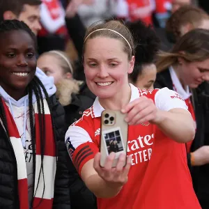 Arsenal Women Celebrate FA WSL Victory: Kim Little Amidst Jubilant Fans