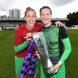 Arsenal Women Celebrate WSL Title Triumph: Sari van Veenendaal and Pauline Peyraud-Magnin Hold the Trophy