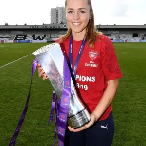 Arsenal Women's Football Team: Celebrating WSL Title Victory with Lia Walti and the Trophy