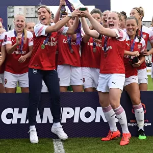 Arsenal Women's Historic WSL Title Win: Kim Little and Jordan Nobbs Celebrate with the Trophy