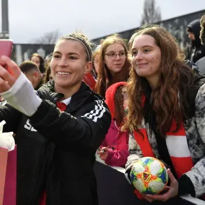 Arsenal Women's Steph Catley Celebrates with Fan after Triumph over Everton at Meadow Park Arsenal Women's Steph Catley Celebrates with Fan after Triumph over Everton at Meadow Park