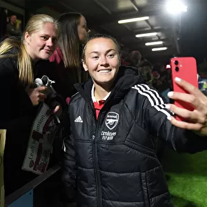 Arsenal Women's Team Celebrates with Fans After Victory Over Brighton in FA WSL