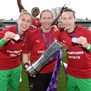 Arsenal Women's Team Celebrates WSL Title with Goalkeepers Sari van Veenendaal, Leanne Hall, and Pauline Peyraud-Magnin