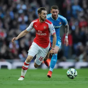 Arsenal's Aaron Ramsey in Action: Arsenal vs. Sunderland (2014-15) Arsenal's Aaron Ramsey in Action: Arsenal vs. Sunderland (2014-15)