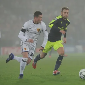 Arsenal's Aaron Ramsey Clashes with Basel's Taulant Xhaka in UEFA Champions League Match Arsenal's Aaron Ramsey Clashes with Basel's Taulant Xhaka in UEFA Champions League Match