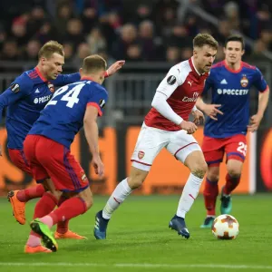 Arsenal's Aaron Ramsey Clashes with CSKA Moscow's Vasili Berezutski in Europa League Quarterfinal