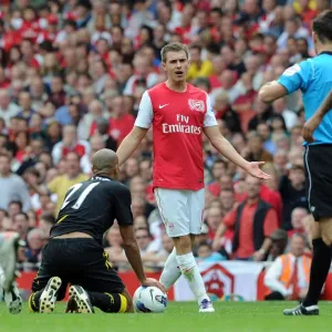 Arsenal's Aaron Ramsey Contests Referee's Call Amidst Arsenal's 3-0 Victory Over Bolton Wanderers Arsenal's Aaron Ramsey Contests Referee's Call Amidst Arsenal's 3-0 Victory Over Bolton Wanderers