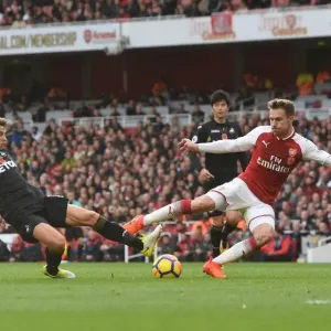 Arsenal's Aaron Ramsey Evades Swansea's Tom Carroll Arsenal's Aaron Ramsey Evades Swansea's Tom Carroll