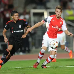 Arsenal's Aaron Ramsey Faces Off Against Besiktas Ramon Motta in UEFA Champions League Qualifier Arsenal's Aaron Ramsey Faces Off Against Besiktas Ramon Motta in UEFA Champions League Qualifier