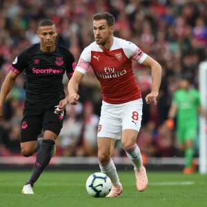 Arsenal's Aaron Ramsey Faces Off Against Everton's Richarlison in Intense Premier League Clash