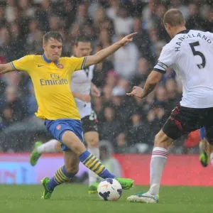 Arsenal's Aaron Ramsey Faces Off Against Fulham's Brede Hangeland in Premier League Clash Arsenal's Aaron Ramsey Faces Off Against Fulham's Brede Hangeland in Premier League Clash