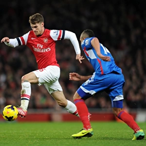 Arsenal's Aaron Ramsey Faces Off Against Hull City's Jake Livermore in Premier League Clash