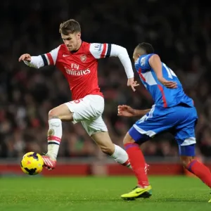 Arsenal's Aaron Ramsey Faces Off Against Hull City's Jake Livermore in Premier League Clash