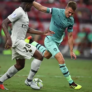Arsenal's Aaron Ramsey Faces Off Against PSG's Loic Mbe Soh in 2018 International Champions Cup