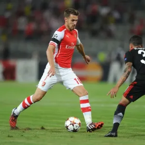 Arsenal's Aaron Ramsey Faces Off Against Ramon Motta in UEFA Champions League Qualifiers (2014): A Battle in Istanbul Arsenal's Aaron Ramsey Faces Off Against Ramon Motta in UEFA Champions League Qualifiers (2014): A Battle in Istanbul