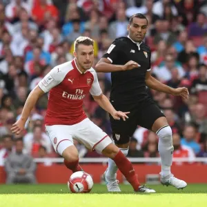 Arsenal's Aaron Ramsey Faces Off Against Sevilla's Gabriel Mercado in Emirates Cup Clash