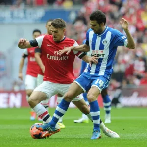 Arsenal's Aaron Ramsey Faces Off Against Wigan's Jordi Gomez in FA Cup Semi-Final Showdown Arsenal's Aaron Ramsey Faces Off Against Wigan's Jordi Gomez in FA Cup Semi-Final Showdown