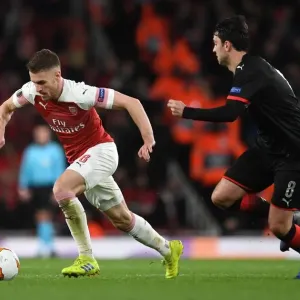 Arsenal's Aaron Ramsey Fends Off Clement Grenier in Europa League Clash
