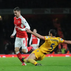 Arsenal's Aaron Ramsey Fouls by Crystal Palace's James Tomkins in Premier League Clash Arsenal's Aaron Ramsey Fouls by Crystal Palace's James Tomkins in Premier League Clash