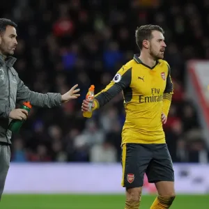 Arsenal's Aaron Ramsey Hydrates with Fitness Coach during AFC Bournemouth Match, 2016-17