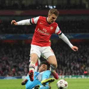 Arsenal's Aaron Ramsey Leaps Past Marseille's Mario Lemina in Champions League Clash Arsenal's Aaron Ramsey Leaps Past Marseille's Mario Lemina in Champions League Clash