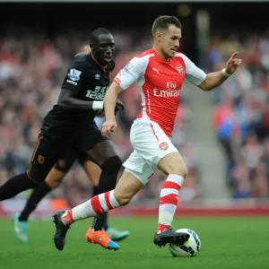 Arsenal's Aaron Ramsey Outmaneuvers Hull's Mohamed Diame Arsenal's Aaron Ramsey Outmaneuvers Hull's Mohamed Diame